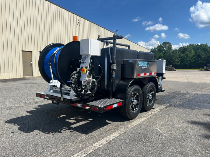A Vactor Ramjet Trailer with a blue hose reel